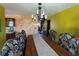 Traditional dining room with decorative walls and large wooden table at 5925 Tortosa Pl, Atlanta, GA 30349