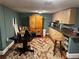 Cozy kitchen with unique wooden cabinets, dark table and patterned rug at 5925 Tortosa Pl, Atlanta, GA 30349