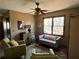 Cozy sitting area with natural light, ceiling fan, art decorations, and comfortable seating at 5925 Tortosa Pl, Atlanta, GA 30349