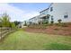 Large backyard featuring grass and a wooden fence at 2436 Hidden Creek Road, Kennesaw, GA 30152