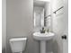 Powder room showcasing pedestal sink, modern faucet, and neutral wall color at 2436 Hidden Creek Road, Kennesaw, GA 30152