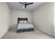 Cozy bedroom with neutral walls and carpet and a rustic-style headboard at 2436 Hidden Creek Road, Kennesaw, GA 30152