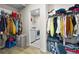 Walk-in closet with metal shelving and a laundry room in the background at 2436 Hidden Creek Road, Kennesaw, GA 30152