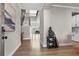 Inviting home entryway featuring wood floors, high ceilings, and staircase to the second floor at 2436 Hidden Creek Road, Kennesaw, GA 30152