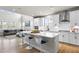 Contemporary kitchen showcases white cabinetry, stainless steel appliances, and a large center island at 2436 Hidden Creek Road, Kennesaw, GA 30152