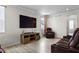 Cozy living room with wood-look floors and comfortable leather seating at 2436 Hidden Creek Road, Kennesaw, GA 30152