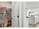 View of a walk-in pantry stocked with shelving, food, and storage containers next to kitchen at 2436 Hidden Creek Road, Kennesaw, GA 30152