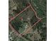 Aerial view of a large lot nestled among trees, accessible by Dial Mill Road NE and Little Haynes Creek at 3880 Dial Mill Ne Rd, Conyers, GA 30013