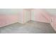 Attic space with sloping ceilings, gray carpeting and multiple access doors at 3880 Dial Mill Ne Rd, Conyers, GA 30013
