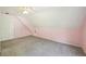 Finished attic featuring carpeting, ample space, a window, and door at 3880 Dial Mill Ne Rd, Conyers, GA 30013