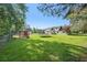 Large backyard view featuring a trampoline, chicken coop, and lots of green space at 3880 Dial Mill Ne Rd, Conyers, GA 30013