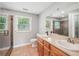 Modern bathroom with a glass shower, double sink vanity, and tiled flooring at 3880 Dial Mill Ne Rd, Conyers, GA 30013