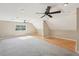 Bonus room features neutral paint, window, carpet and hard wood floors at 3880 Dial Mill Ne Rd, Conyers, GA 30013