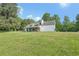 Charming single-Gathering home featuring a stone facade, dormer windows and a lush, green lawn at 3880 Dial Mill Ne Rd, Conyers, GA 30013