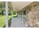 Stone-clad front porch with ample space for outdoor seating at 3880 Dial Mill Ne Rd, Conyers, GA 30013