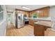 The kitchen features stainless appliances, and a cozy breakfast bar at 3880 Dial Mill Ne Rd, Conyers, GA 30013