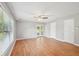 Inviting living room with hardwood floors, a window view, and easy access to the backyard at 3880 Dial Mill Ne Rd, Conyers, GA 30013