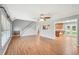 Open-concept living room with staircase and doorway to the kitchen at 3880 Dial Mill Ne Rd, Conyers, GA 30013