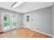 Bright sunroom with wood-look flooring, and a view of the backyard at 3880 Dial Mill Ne Rd, Conyers, GA 30013