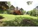 Lush backyard with a wooden deck, perfect for outdoor entertaining and relaxation at 5665 Stewart Woods Dr, Douglasville, GA 30135