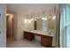 Bathroom boasts double sink vanity, large mirror, and generous space for storage and grooming at 5665 Stewart Woods Dr, Douglasville, GA 30135
