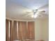 Cozy bedroom featuring a ceiling fan and lots of natural light streaming through the windows at 5665 Stewart Woods Dr, Douglasville, GA 30135