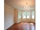 Elegant dining room featuring hardwood floors, a chandelier, and a bay window, ideal for entertaining at 5665 Stewart Woods Dr, Douglasville, GA 30135
