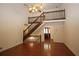 Inviting living room with a high ceiling, wooden staircase, and hardwood floors, creating an open and airy feel at 5665 Stewart Woods Dr, Douglasville, GA 30135