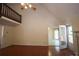 Open living room with a high ceiling, hardwood floors, and French doors leading to an adjacent area at 5665 Stewart Woods Dr, Douglasville, GA 30135