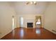 Bright living room with a fireplace, hardwood floors, and access to the outdoors, perfect for relaxation at 5665 Stewart Woods Dr, Douglasville, GA 30135