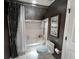 Bathroom featuring a tub and decorative shower curtain, complete with tile at 999 Ashebrooke Ne Way, Marietta, GA 30068