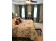 Cozy bedroom featuring bright, natural light, patterned bedding, and decorative pillows at 999 Ashebrooke Ne Way, Marietta, GA 30068