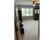 Bright bedroom featuring large windows, neutral carpet, and a ceiling fan for comfortable living at 999 Ashebrooke Ne Way, Marietta, GA 30068