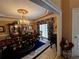 Formal dining room with elegant chandelier, large table, floral accents, and window at 999 Ashebrooke Ne Way, Marietta, GA 30068