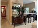 Hallway area features an antique dresser, ornate mirror, and a glimpse of the wet bar area at 999 Ashebrooke Ne Way, Marietta, GA 30068