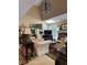 Bright living room with high ceilings, skylights, a fireplace, and elegant furnishings at 999 Ashebrooke Ne Way, Marietta, GA 30068