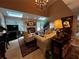 Spacious living room with skylights, fireplace, chandelier and views into other rooms at 999 Ashebrooke Ne Way, Marietta, GA 30068