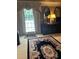 Large main bedroom with dark wood dresser and decoratively patterned area rug at 999 Ashebrooke Ne Way, Marietta, GA 30068