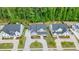 Aerial view of luxury homes with well-manicured lawns and a circular driveway, showcasing curb appeal at 107 Owens Mill Place, Canton, GA 30115