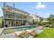 Beautiful backyard featuring a swimming pool, hot tub, lounge chairs, and a covered patio for relaxation and entertainment at 107 Owens Mill Place, Canton, GA 30115