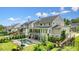 Expansive backyard with a pool, hot tub, lush landscaping, and multi-level deck; perfect for outdoor entertaining at 107 Owens Mill Place, Canton, GA 30115