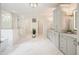 Bright bathroom with a glass shower, garden tub, and double vanity at 107 Owens Mill Place, Canton, GA 30115