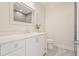Elegant bathroom features a white vanity with a decorative mirror and modern fixtures at 107 Owens Mill Place, Canton, GA 30115