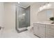 Modern bathroom with marble floors, gray vanity, and walk-in shower featuring gray subway tile at 107 Owens Mill Place, Canton, GA 30115