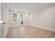Empty bedroom with hardwood floors, recessed lights, windows with blinds, and a french door at 107 Owens Mill Place, Canton, GA 30115