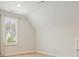Cozy bedroom featuring hardwood floors, neutral paint, and a window with blinds at 107 Owens Mill Place, Canton, GA 30115