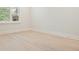 Bright, empty bedroom with neutral paint, plantation blinds, and light-colored wood flooring at 107 Owens Mill Place, Canton, GA 30115