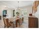 Dining room with chandelier, wood table, and large window with views of the exterior at 107 Owens Mill Place, Canton, GA 30115