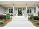Inviting front porch with seating, stylish décor, and a welcoming entrance, perfect for relaxing and entertaining at 107 Owens Mill Place, Canton, GA 30115