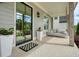 Elegant front porch featuring a swing and stylish décor, perfect for relaxing and enjoying the outdoor ambiance at 107 Owens Mill Place, Canton, GA 30115